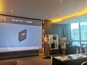 Chen Jiang from Pi and Fan Shuxing from Beijing Anyuan introducing Pi's products